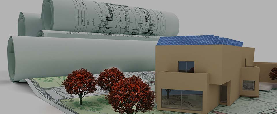  Planimetrie arrotolate accanto al modellino tridimensionale di un progetto immobiliare ecosostenibile